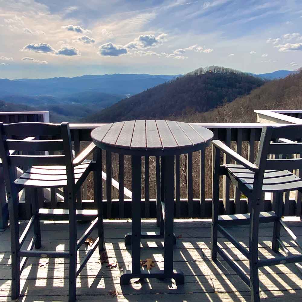 view from deck with table and chairs